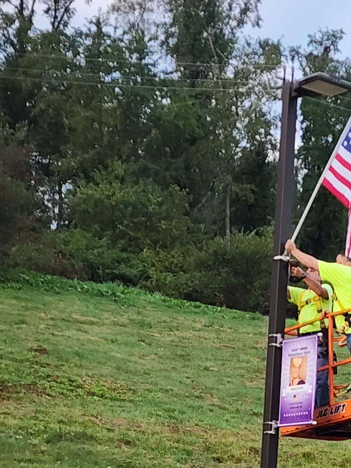 Ethan watches as the flags are installedEthan Nesbit