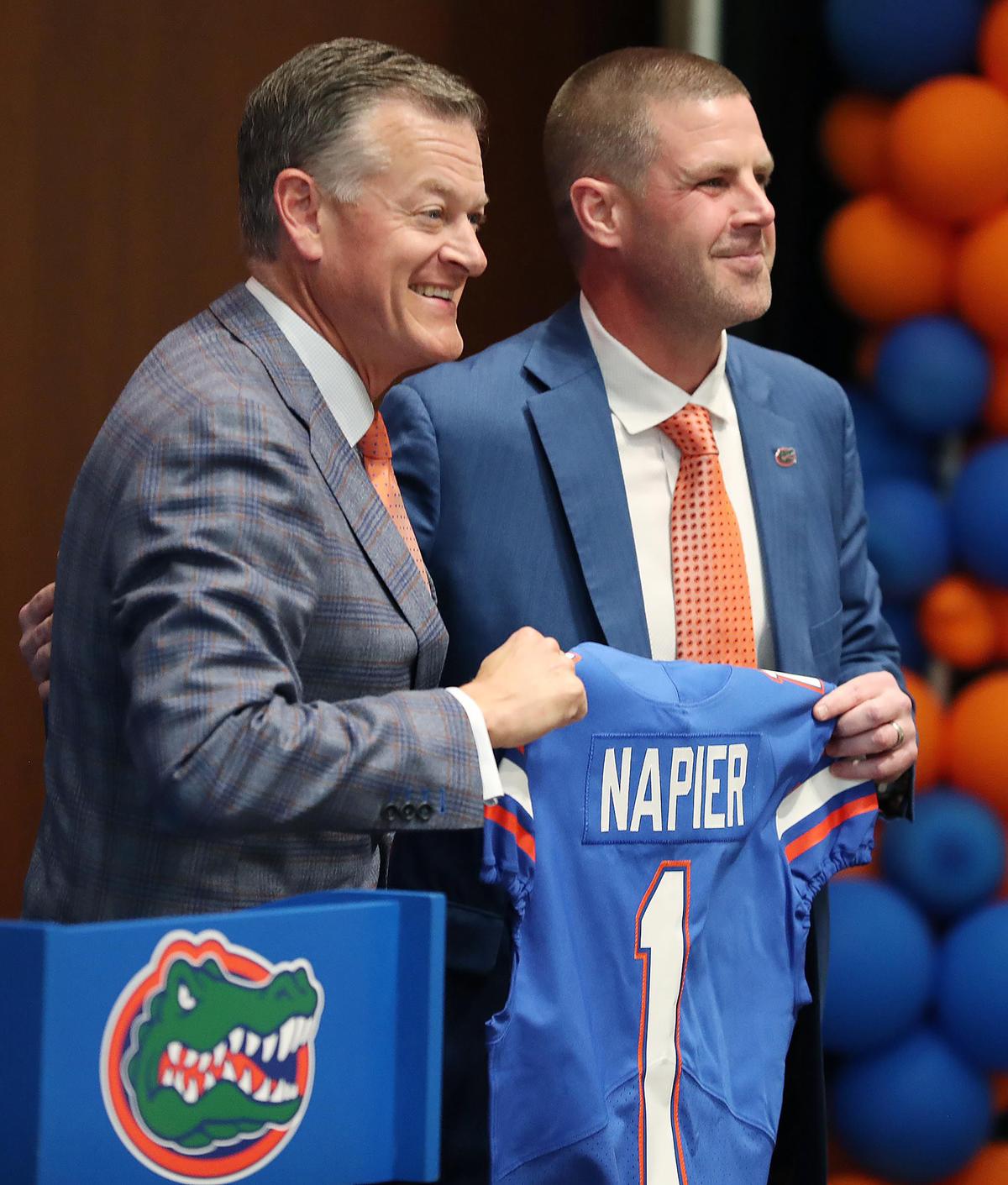Florida athletic director Scott Stricklin, left, poses with Billy Napier during a news conference at Ben Hill Griffin Stadium on the campus of the University of Florida on Dec. 5, 2021, in Gainesville, Florida, as Napier is introduced at the new head coach. (Stephen M. Dowell/Orlando Sentinel/TNS)