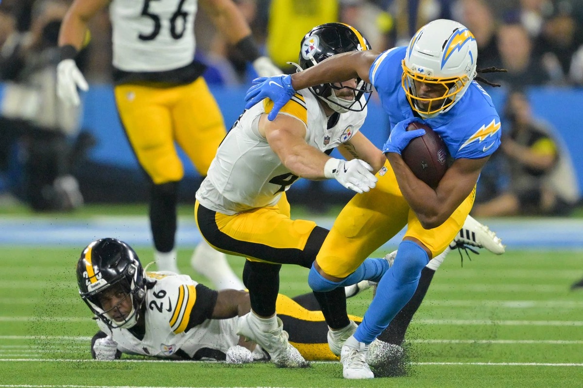  Nov 9, 2025; Inglewood, California, USA; Los Angeles Chargers wide receiver Quentin Johnston (1) carries the ball after a reception defended by Pittsburgh Steelers linebacker Payton Wilson (41) during the first quarter of the game at SoFi Stadium. Mandatory Credit: Jayne Kamin-Oncea-Imagn Images reuters.com,2025:newsml_MT1USATODAY27549667:333578393