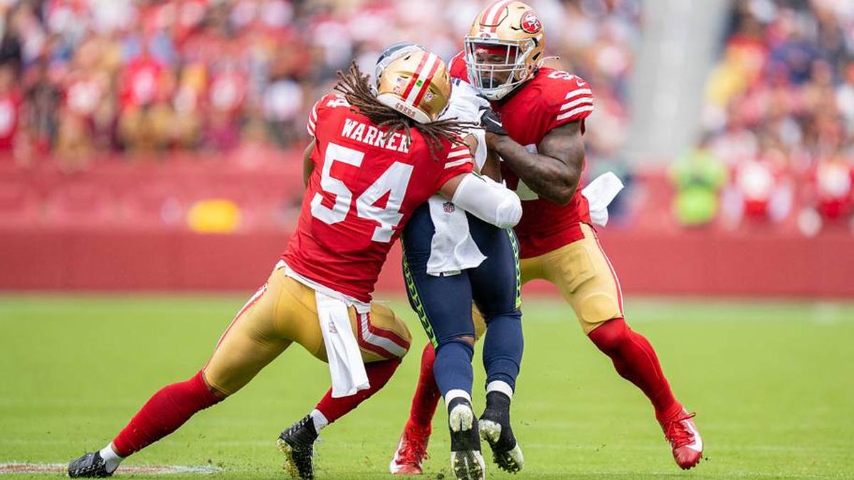 September 18, 2022; Santa Clara, California, USA; San Francisco 49ers linebacker Fred Warner (54) and linebacker Dre Greenlaw (57) tackle Seattle Seahawks running back Kenneth Walker III (9) during the third quarter at Levi's Stadium. Mandatory Credit: Kyle Terada-Imagn Images | Kyle Terada-Imagn Images 