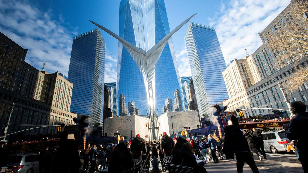 People walk around the Financial District near the New York Stock Exchange (NYSE) in New York, U.S., December 29, 2023. REUTERS/Eduardo Munoz