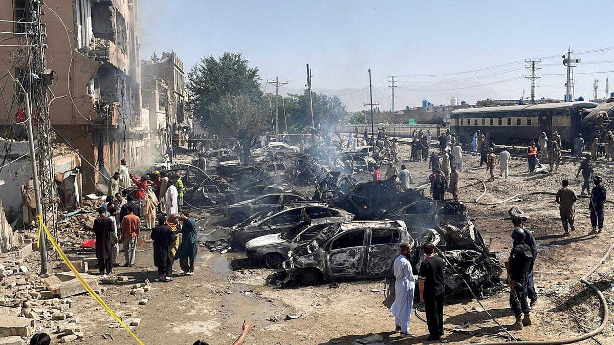 People and police officers gather after a blast near a railway track in Quetta, Pakistan, May 24, 2026. Picture taken with a mobile phone. REUTERS/Stringer