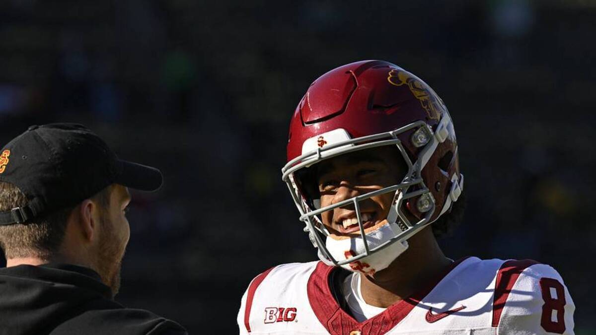  Nov 22, 2025; Eugene, Oregon, USA; Southern California Trojans wide receiver Ja'Kobi Lane (8) talks to a coach before the game against the Oregon Ducks at Autzen Stadium. Mandatory Credit: Troy Wayrynen-Imagn Images | Troy Wayrynen-Imagn Images 