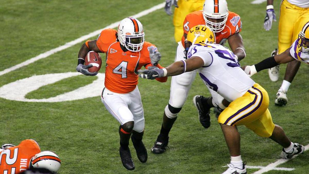  Dec 30, 2005; Atlanta, GA, USA; The Miami Hurricanes (4) Devin Hester runs back a kick as he gets a block from (6) Randy Phillips against the Louisiana State Tigers (90) Melvin Oliver in first half action at the Peach Bowl at the Georgia Dome. Mandatory Credit: Photo by Dale Zanine Imagn Images Copyright (c) 2005 Dale Zanine | Dale Zanine-Imagn Images 