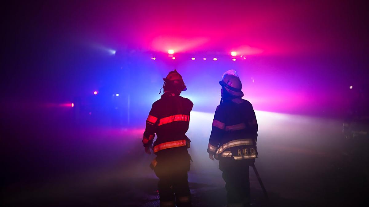 Minneapolis firefighters watch efforts to put down a large fire in a residential apartment building on Aug. 13, 2024, in Minneapolis. (Aaron Lavinsky/The Minnesota Star Tribune/TNS)