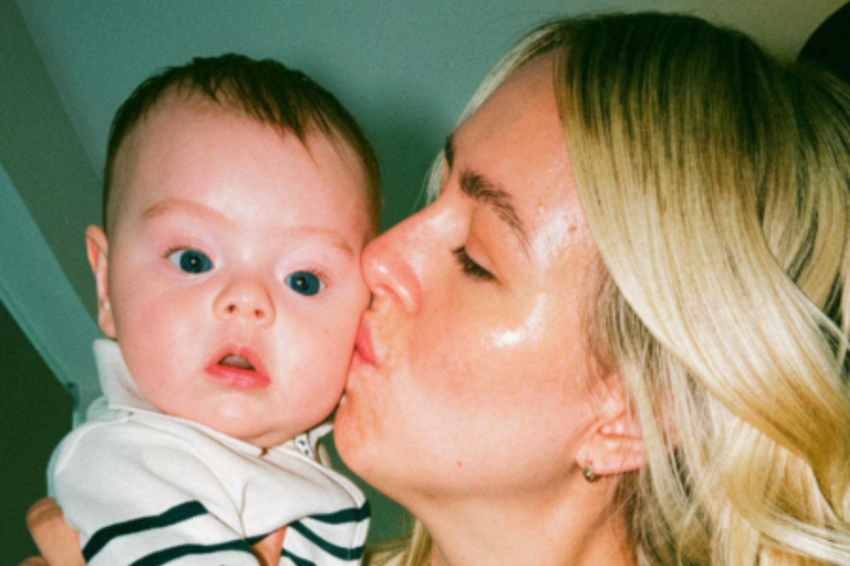  Mom Tamara Bright kisses her baby boy Mason as she holds him. 