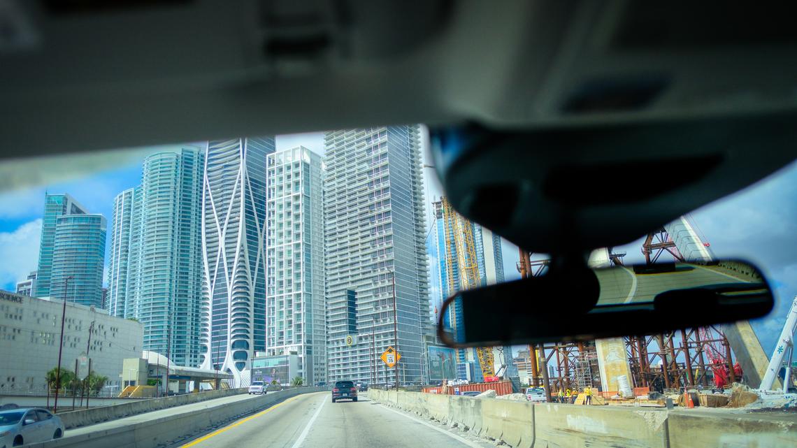 Driving on a freeway through an urban city in the USA showing urban hirise buildings from the drivers point of view. Driving on a freeway through Miami on March 11, 2026.