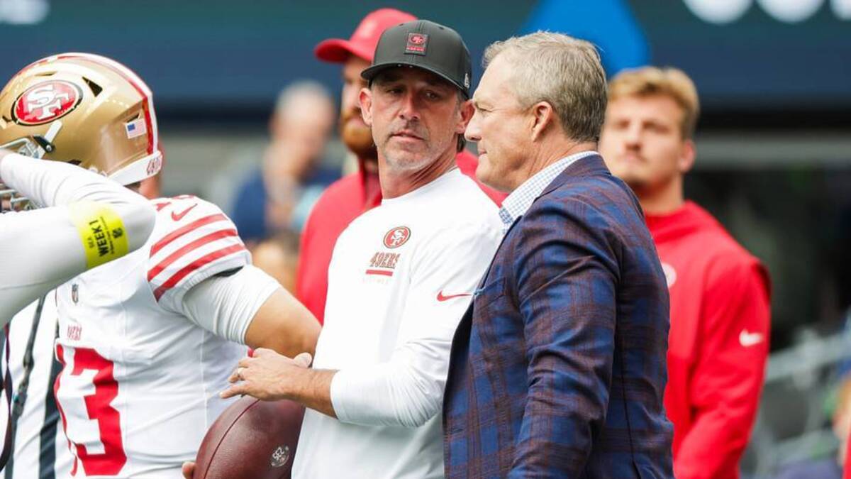 Sep 7, 2025; Seattle, Washington, USA; San Francisco 49ers general manager John Lynch, right, talks with head coach Kyle Shanahan during pregame warmups against the Seattle Seahawks at Lumen Field. Mandatory Credit: Joe Nicholson-Imagn Images | IMAGN IMAGES via Reuters Connect 