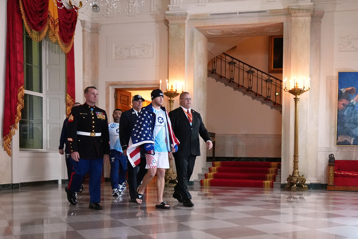 Justin Gaethje walks through the Grand Foyer of the White House before his lightweight title bout with Ilia Topuria, not pictured, during UFC Freedom 250 on the South Lawn of the White House, Monday, June 15, 2026, in Washington. Jacquelyn Martin/Pool via REUTERS