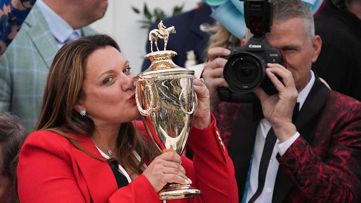  Trainer Cherie DeVaux kisses the trophy after her horse Golden Tempo won the Kentucky Derby. | Matt Stone/Courier Journal / USA TODAY NETWORK via Imagn Images 