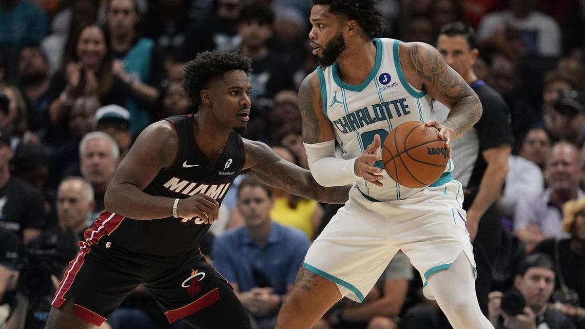 Late OT heroics lift Hornets over Heat in play-in game 