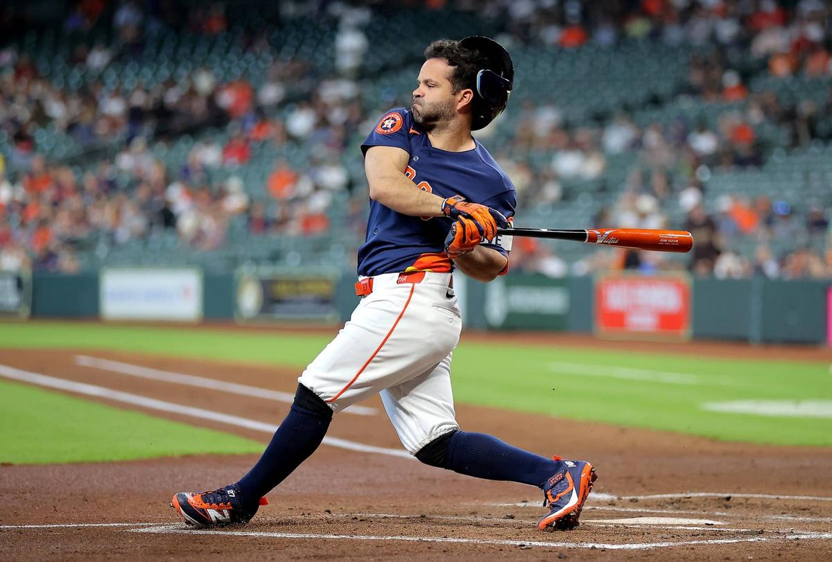  May 14, 2026; Houston, Texas, USA; Houston Astros second baseman Jose Altuve (27) loses his helmet after swinging at a pitch against the Seattle Mariners during the first inning at Daikin Park. Mandatory Credit: Erik Williams-Imagn Images
