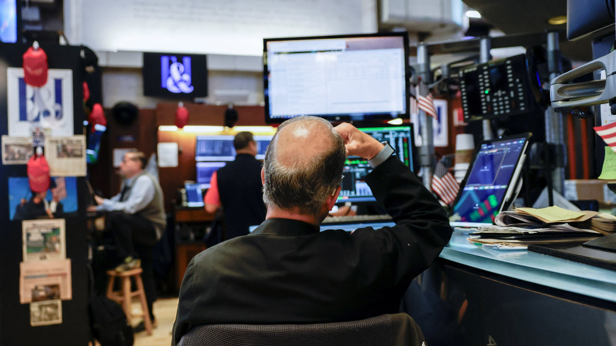 A trader works on the floor at the New York Stock Exchange (NYSE) in New York City, U.S., June 18, 2026. REUTERS/Jeenah Moon