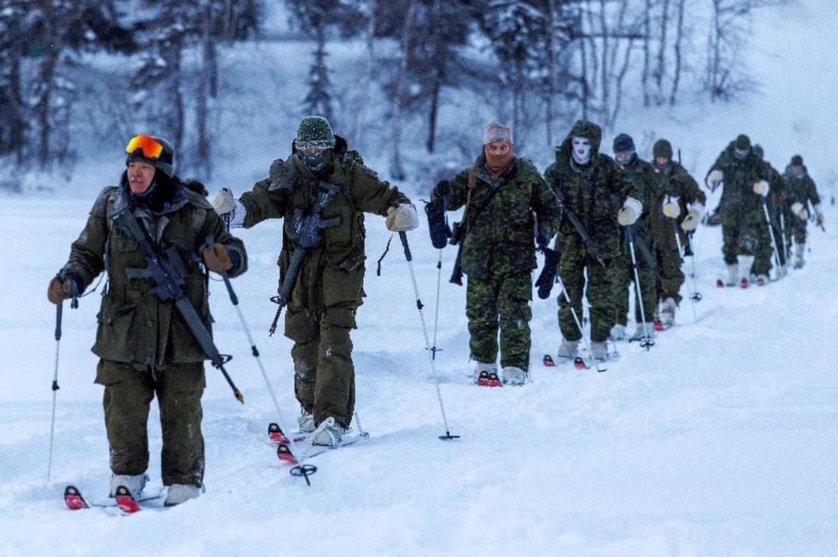 FILE PHOTO: Members of 41 Canadian Brigade Group, as part of Task Force Grizzly, patrol on skis as Canadian Armed Forces deploy to "Operation Nanook-Nunalivut," a yearly series of drills designed to highlight the military's ability to defend the Canadian Arctic, in Yellowknife, Northwest Territories, Canada, February 16, 2026. REUTERS/Carlos Osorio/File Photo