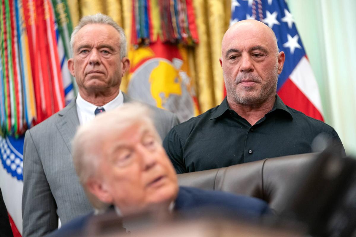  Joe Rogan (R), Robert F. Kennedy Jr. (L) look on as U.S. President Donald Trump speaks. Allison Robbert/The Washington Post-GettyImages