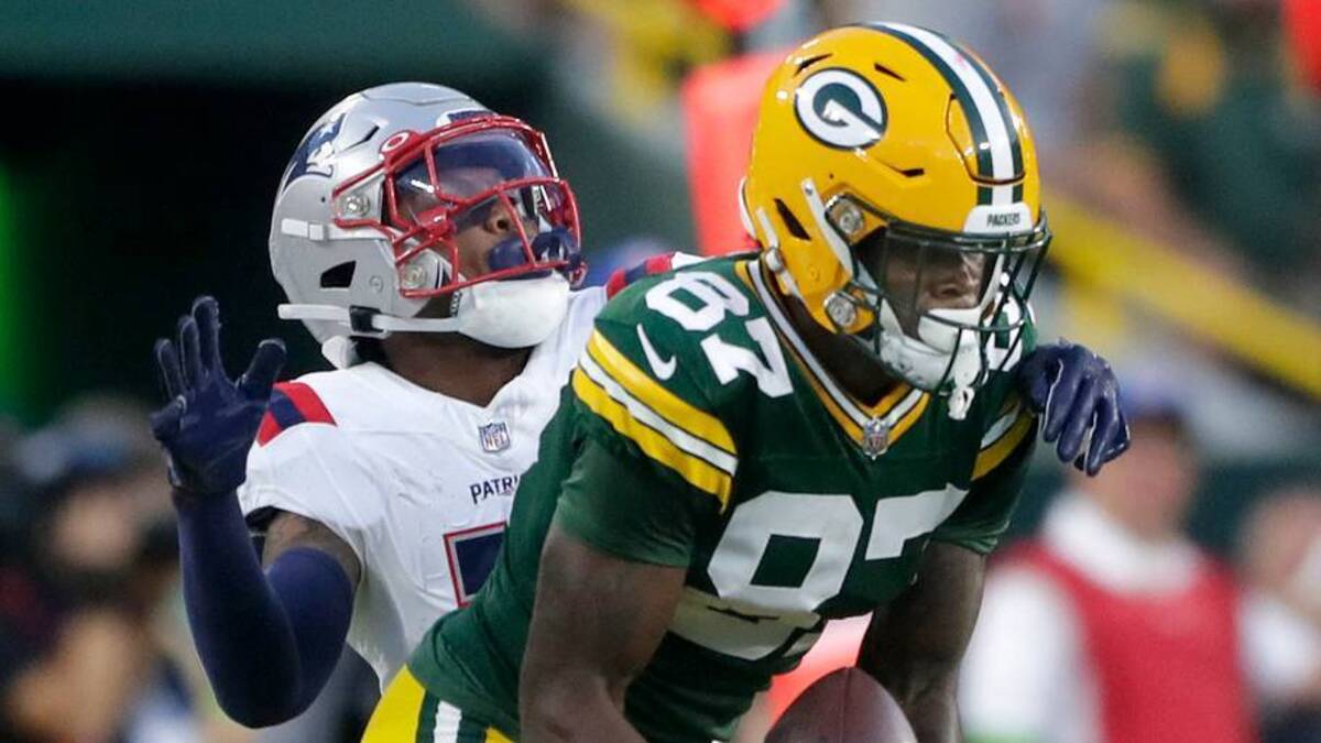  Aug 19, 2023; Green Bay, WI, USA; Green Bay Packers wide receiver Romeo Doubs (87) makes a sideline reception, in the first quarter, in front of New England Patriots cornerback Isaiah Bolden (7) during their preseason football game at Lambeau Field. Mandatory Credit: William Glasheen-USA TODAY Sports | USA TODAY Sports via Reuters Connect 