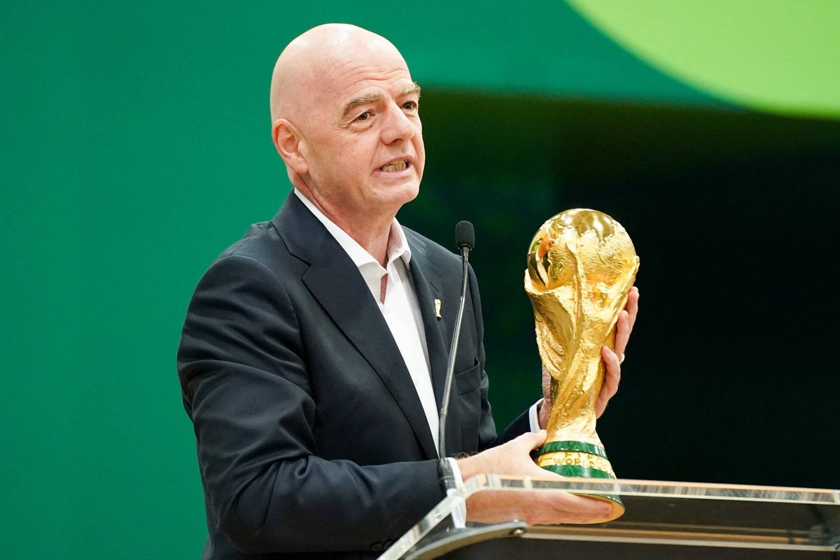  FIFA President Gianni Infantino holds the World Cup trophy. Raymond Carlin III-Imagn Images