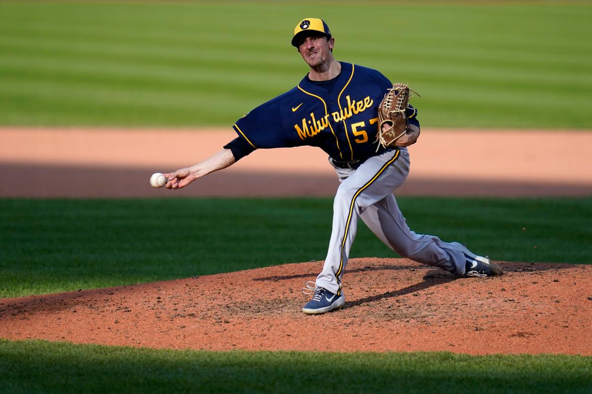 Milwaukee Brewers relief pitcher Eric Yardley throws during a baseball game against the St. Louis Cardinals in 2020.