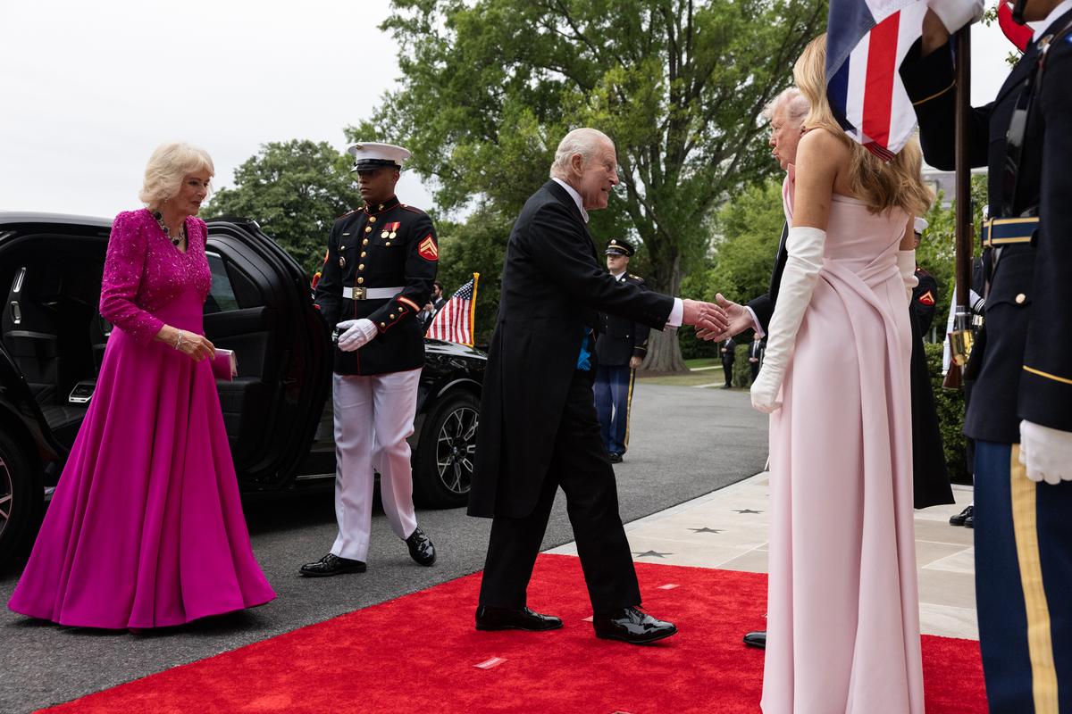 President Donald Trump and first lady Melania Trump, right, greet King Charles III and Queen Camilla of the United Kingdom as they arrive for a state dinner at the White House in Washington, on Tuesday, April 28, 2026. (Anna Rose Layden/The New York Times)