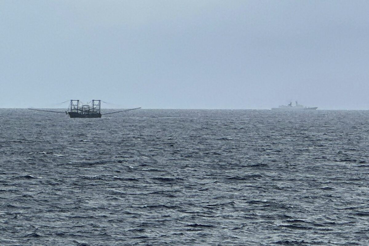  A Chinese navy ship, right, and a Chinese vessel draw the attention of a Philippine maritime patrol in the disputed South China Sea on June 6, 2025. AP Photo/Joeal Calupitan 