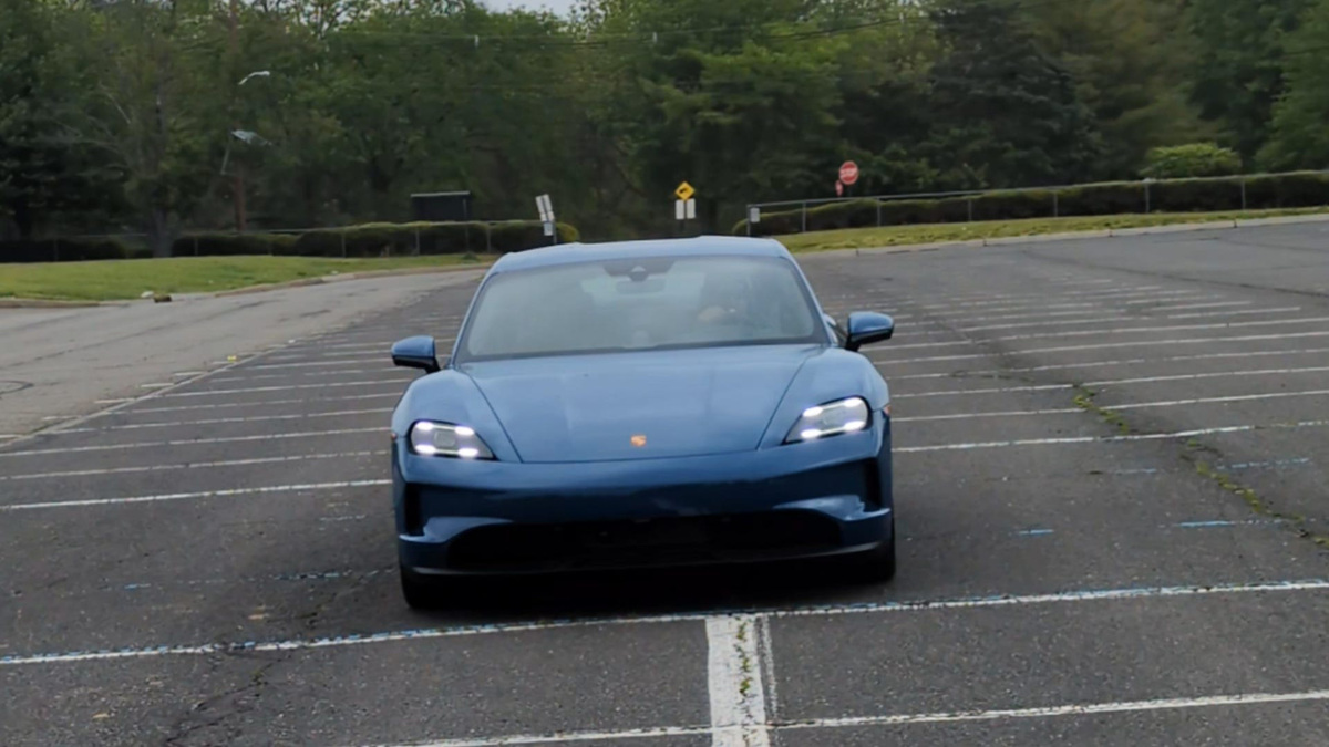 The 2025 Porsche Taycan is driving.
