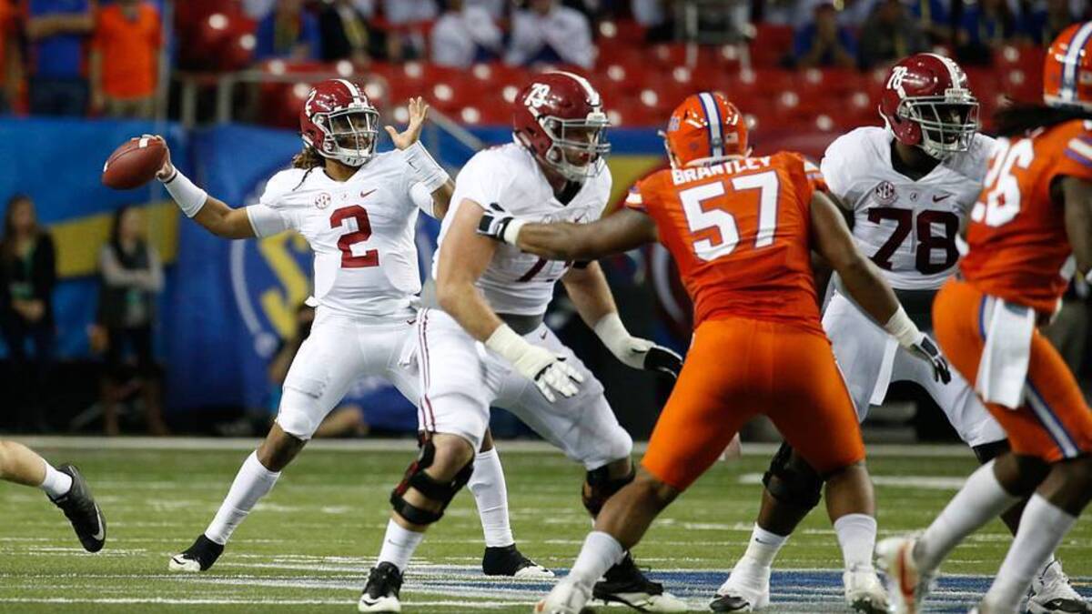  Dec 3, 2016; Atlanta, GA, USA; Alabama Crimson Tide quarterback Jalen Hurts (2) attempts a pass as offensive lineman Jonah Williams (73) blocks Florida Gators defensive lineman Caleb Brantley (57) during the second quarter of the SEC Championship college football game at Georgia Dome. Alabama defeated Florida 54-16. | IMAGN IMAGES via Reuters Connect 
