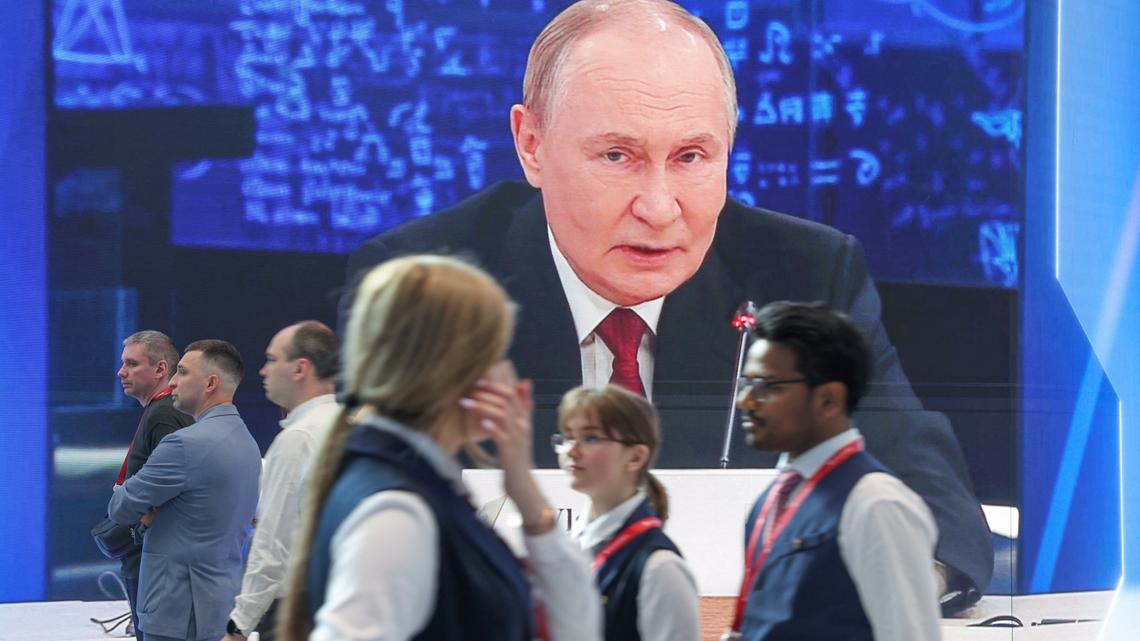 Putin faces rival visions of war and peace at Russia's 'Davos' 
