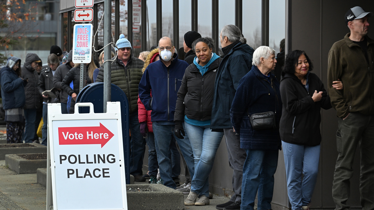 Voters wait in line outside the Alaska Division of Elections Region II office on Gambell Street in Midtown Anchorage, Alaska, in 2024. (Bill Roth/Anchorage Daily News/TNS)