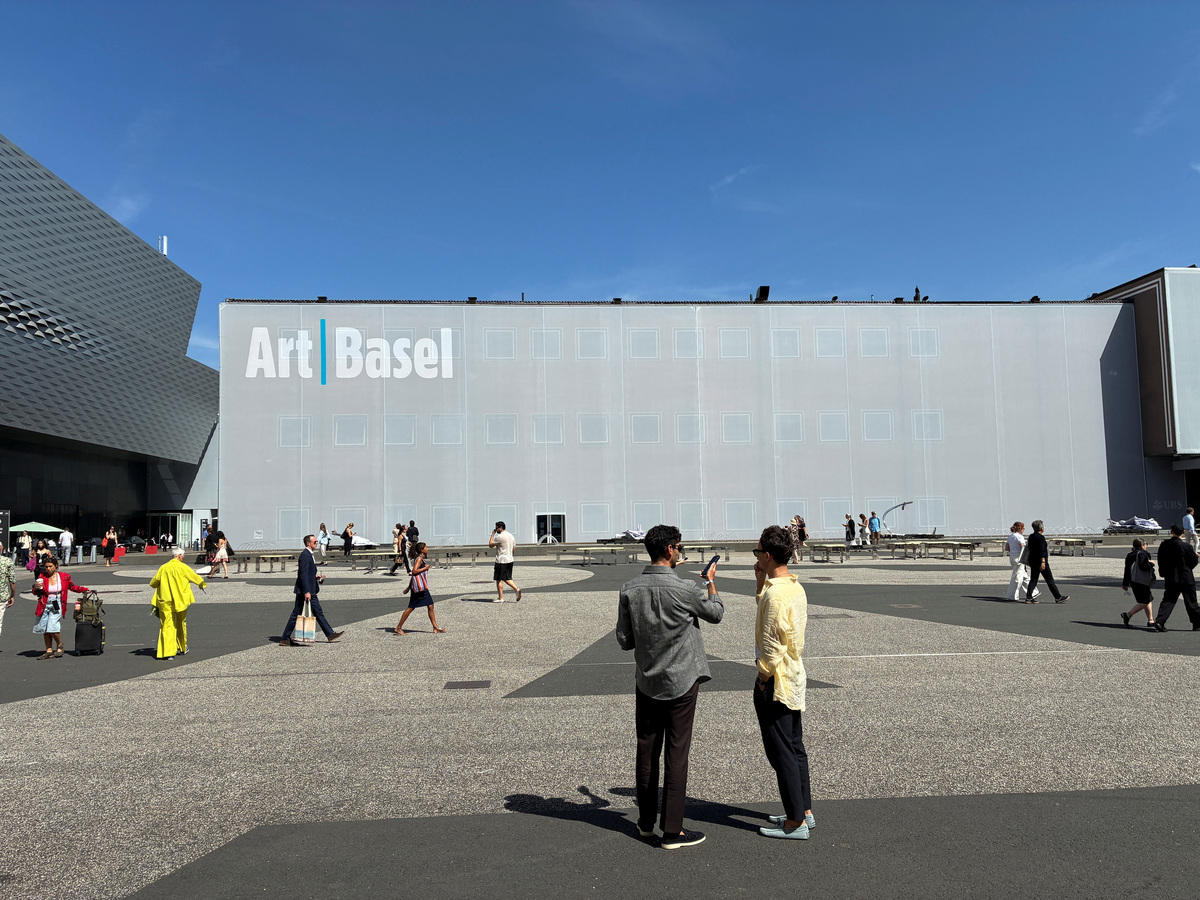Visitors walk outside Art Basel, in Basel, Switzerland, June 17, 2026. Picture taken with a mobile phone. REUTERS/Marleen Kaesebier