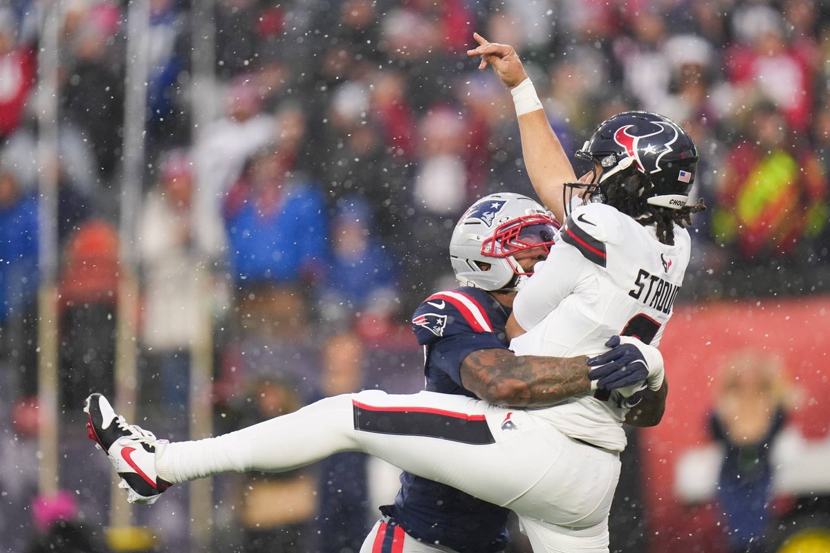  Jan 18, 2026; Foxborough, MA, USA; New England Patriots linebacker K'Lavon Chaisson (44) tackles Houston Texans quarterback C.J. Stroud (7) in the second quarter in an AFC Divisional Round game at Gillette Stadium. David Butler II-Imagn Images David Butler II-Imagn Images