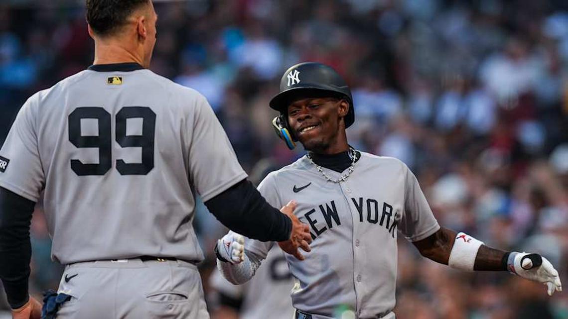  New York Yankees second baseman Jazz Chisholm Jr. (13) reacts with right fielder Aaron Judge (99) after hitting a home run against the Boston Red Sox in the fifth inning at Fenway Park | David Butler II-Imagn Images 