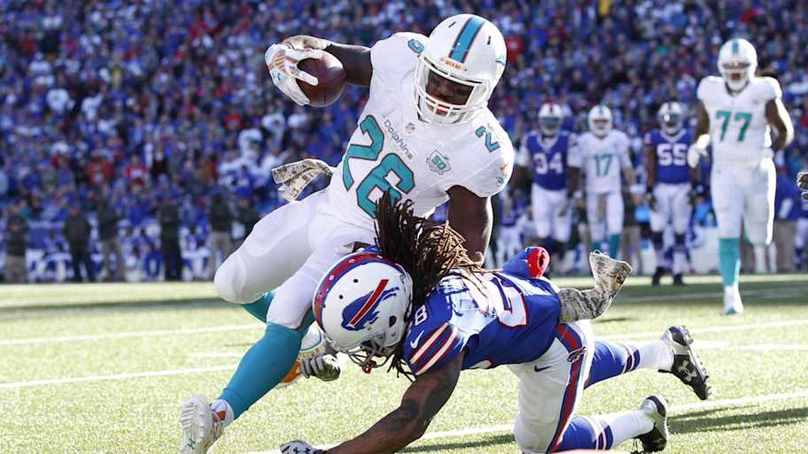  Buffalo Bills cornerback Ronald Darby (28) tackles Miami Dolphins running back Lamar Miller (26) short of the end zone during the first half at Ralph Wilson Stadium in a 2015 game. | Kevin Hoffman-Imagn Images 