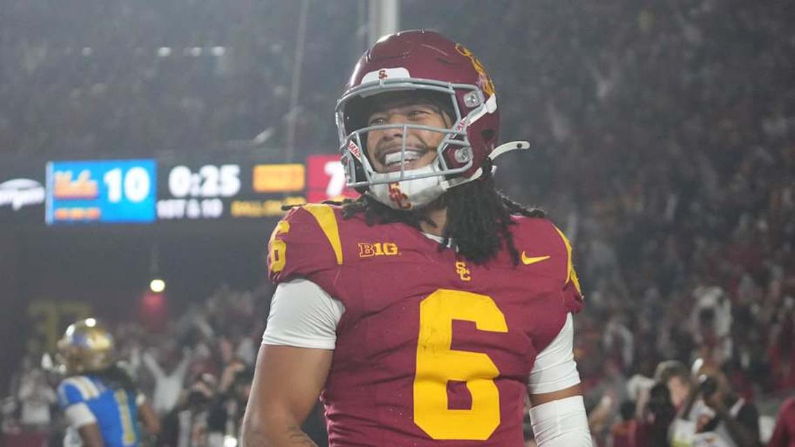  Nov 29, 2025; Los Angeles, California, USA; Southern California Trojans wide receiver Makai Lemon (6) celebrates after catching a 32-yard touchdown pass against the UCLA Bruins in the second half at United Airlines Field at Los Angeles Memorial Coliseum. Mandatory Credit: Kirby Lee-Imagn Images | Kirby Lee-Imagn Images 