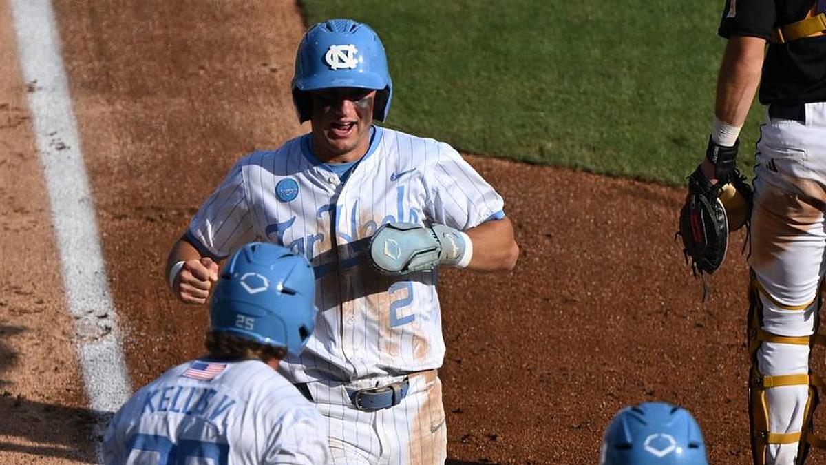  May 31, 2026; Chapel Hill, NC, USA; North Carolina Tar Heels infielder Jake Schaffner (2) is greeted at the plate after scoring by outfielder Rom Kellis (25) and catcher MacOn Winslow (6) against the East Carolina Pirates during the Chapel Hill Regional at Boshamer Stadium. | William Howard-Imagn Images 