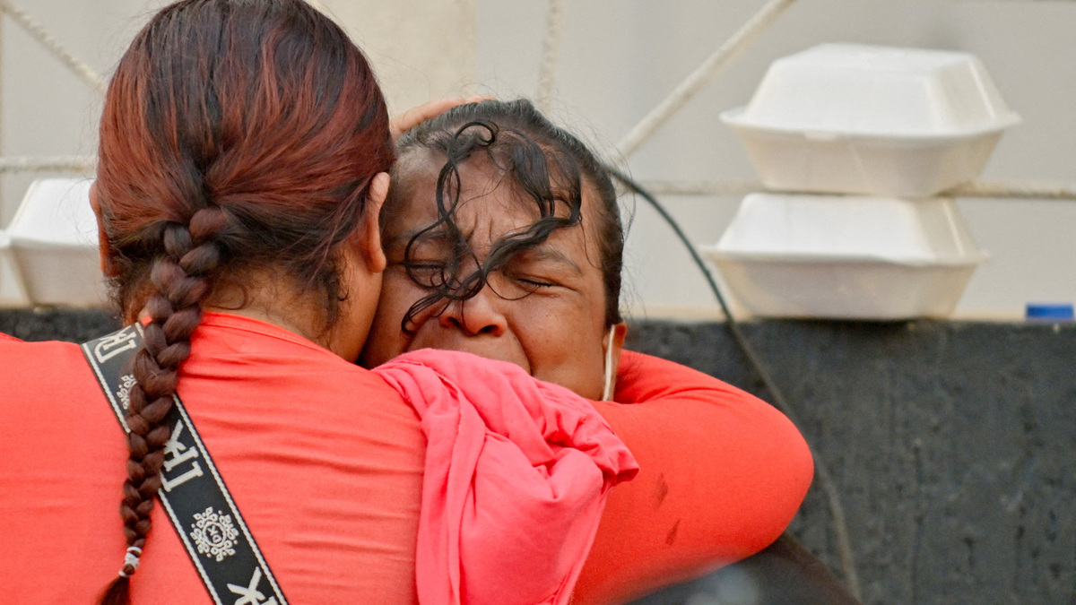 People embrace, as rescue operations continue after earthquakes hit the country in La Guaira, Venezuela, June 27, 2026. REUTERS/Maxwell Briceno