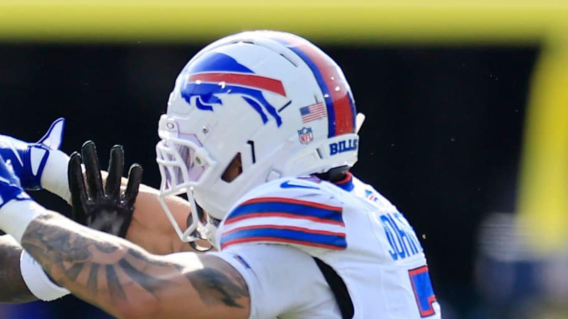  Jacksonville Jaguars running back Travis Etienne Jr. (1) rushes for yards against Buffalo Bills cornerback Taron Johnson (7) during the second quarter of an NFL football AFC Wild Card playoff matchup, Sunday, Jan. 11, 2026, in Jacksonville, Fla. [Corey Perrine/Florida Times-Union] | Corey Perrine/Florida Times-Union / USA TODAY NETWORK via Imagn Images 