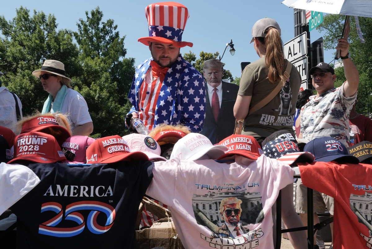 People walk by vendors outside the National Archives as they celebrate the 250th anniversary of the United States in Washington, July 4, 2026. America celebrates the 250th anniversary of its independence today, with people from one end of the country to the other marking the milestone with fireworks, parades and concerts. (Alex Kent/The New York Times)