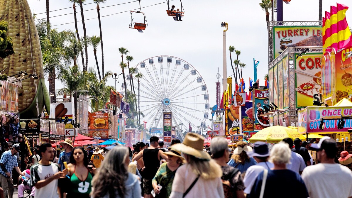Fairgoers walk through the San Diego County Fair in Del Mar during the first day on Wednesday, June 10, 2026. (Kristian Carreon / The San Diego Union-Tribune)