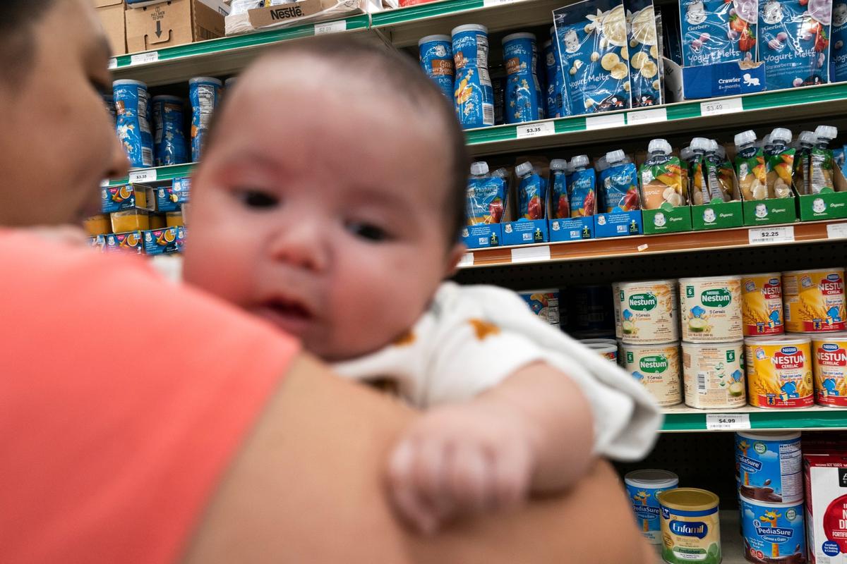 Yury Navas, 29, of Laurel, Md., looks for a specialized formula that is out of stock for her two-month-old baby Ismael Galvaz on May 23, 2022. (AP Photo/Jacquelyn Martin)