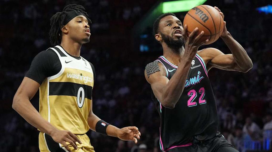  Apr 4, 2026; Miami, Florida, USA; Miami Heat forward Andrew Wiggins (22) goes up for a shot as Washington Wizards guard Bilal Coulibaly (0) defends during the first half at Kaseya Center. Mandatory Credit: Jim Rassol-Imagn Images | Jim Rassol-Imagn Images 