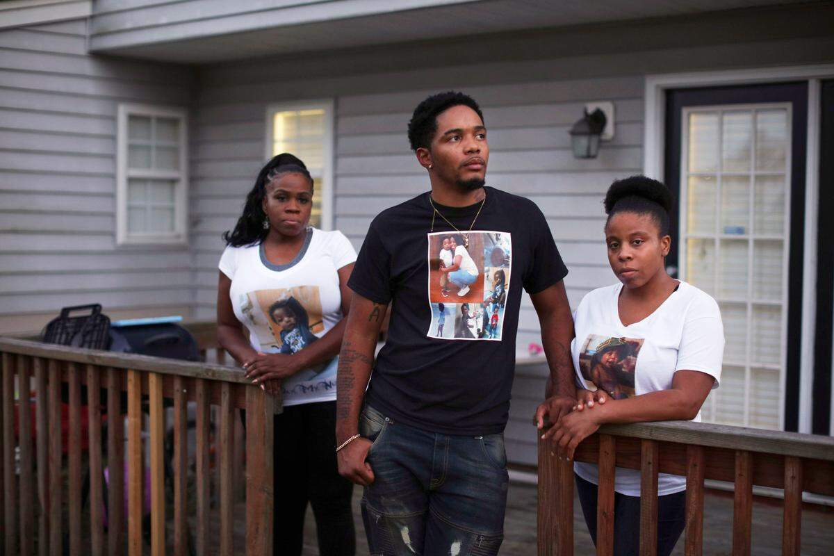 Quanasia Dean, right, and Sean Moore, whose young son Jeremiah died after a third cardiac surgery, at home with Inez Holmes, the boy’s grandmother, in Raleigh, N.C., Oct. 5, 2018. Jeremiah’s parents considered taking him to Philadelphia for surgery, but said a doctor at UNC persuaded them to stay in Chapel Hill.