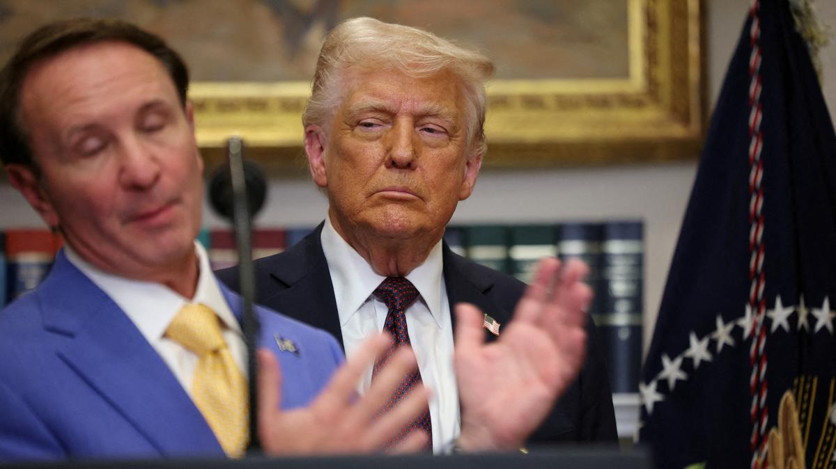 FILE PHOTO: U.S. President Donald Trump listens as Governor of Louisiana Jeff Landry delivers remarks, in the Roosevelt Room at the White House, in Washington, D.C., U.S., March 24, 2025. REUTERS/Carlos Barria/File Photo
