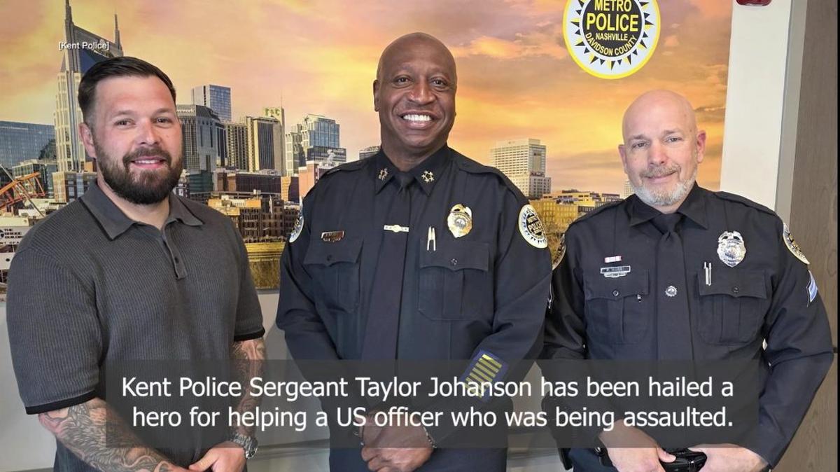 Off-duty Sgt. Taylor Johanson, left, with police officers in Nashville. (Metropolitan Nashville Police Department via SWNS). 