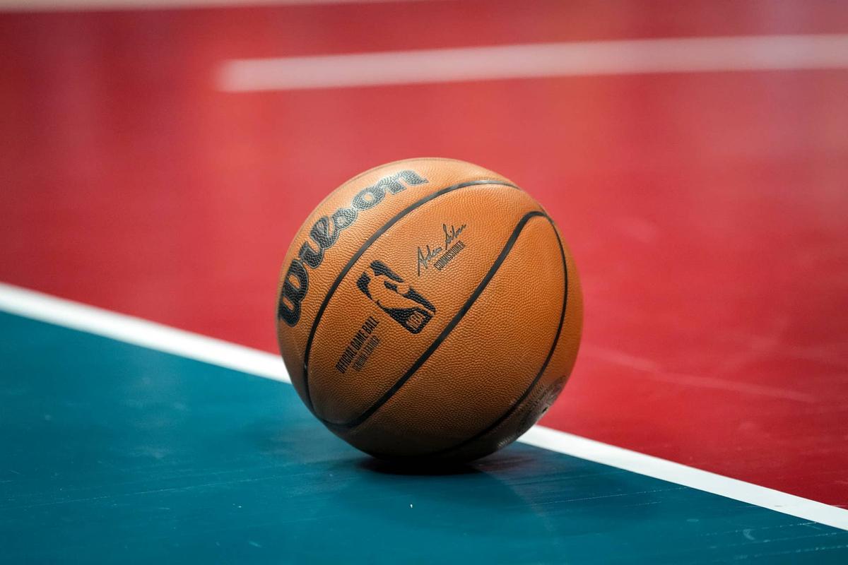  DETROIT, MICHIGAN - FEBRUARY 03: A Wilson brand official game ball basketball is pictured with the NBA logo during the game between the Detroit Pistons and Charlotte Hornets at Little Caesars Arena on February 03, 2023 in Detroit, Michigan. (Photo by Nic Antaya/Getty Images) 