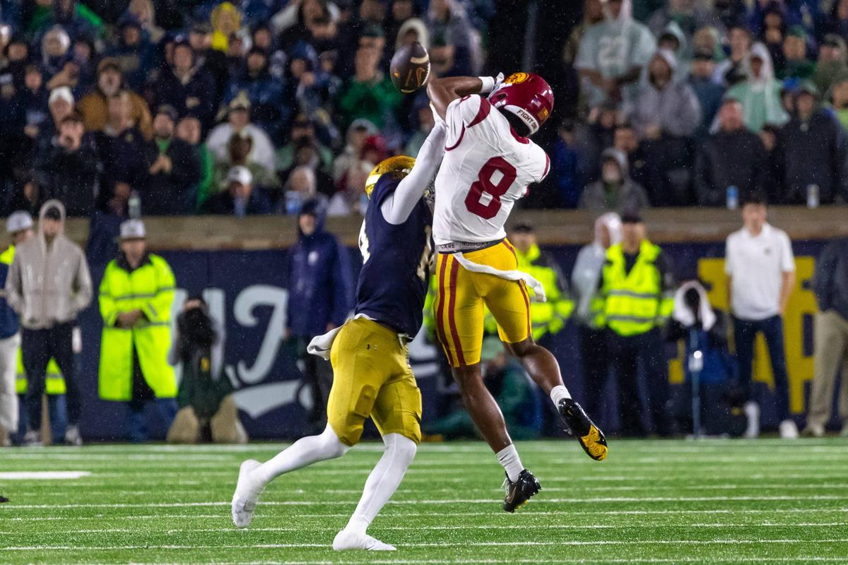  Oct 18, 2025; South Bend, Indiana, USA; Notre Dame Fighting Irish cornerback Dallas Golden (14) breaks up a pass intended for Southern California Trojans wide receiver Ja'Kobi Lane (8) during the second half at Notre Dame Stadium. Mandatory Credit: Michael Caterina-Imagn Images 