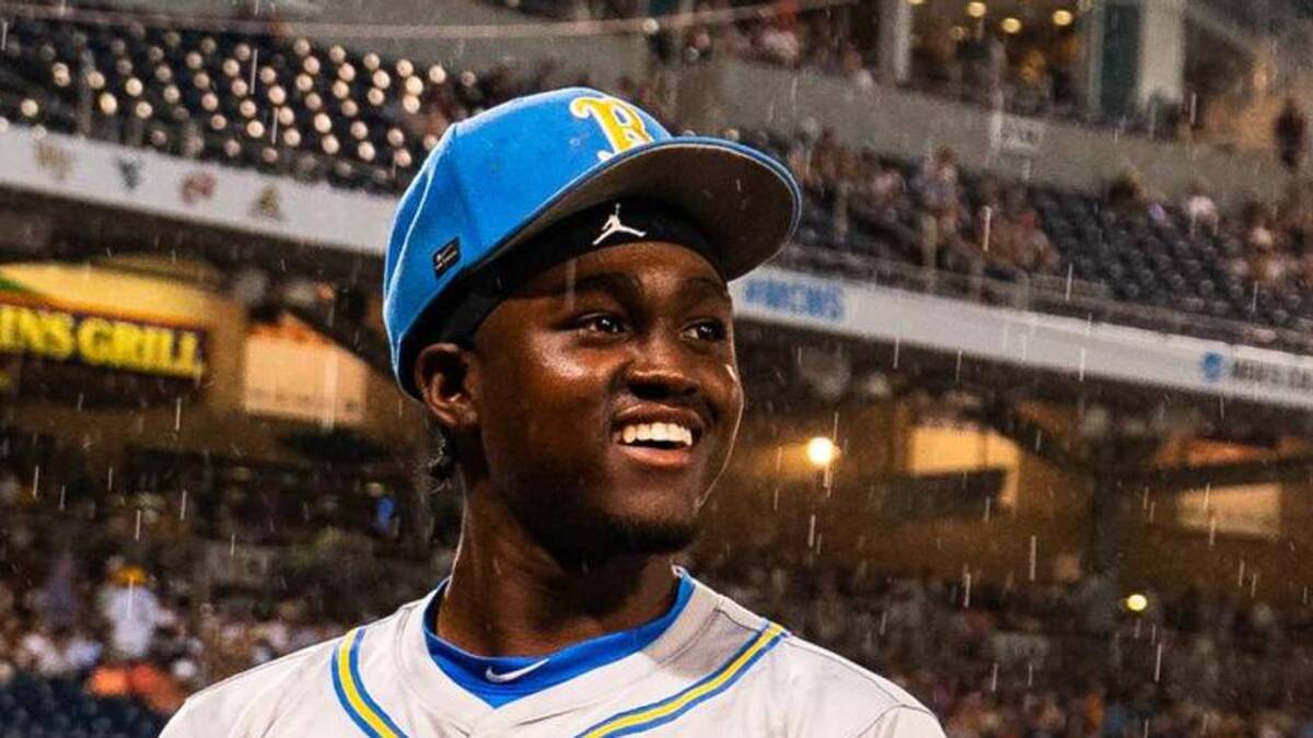  Jun 16, 2025; Omaha, Neb, USA; UCLA Bruins left fielder Dean West (36) sits in the dugout in the rain during a storm delay in the fourth inning against the LSU Tigers at Charles Schwab Field. Mandatory Credit: Dylan Widger-Imagn Images | Dylan Widger-Imagn Images 
