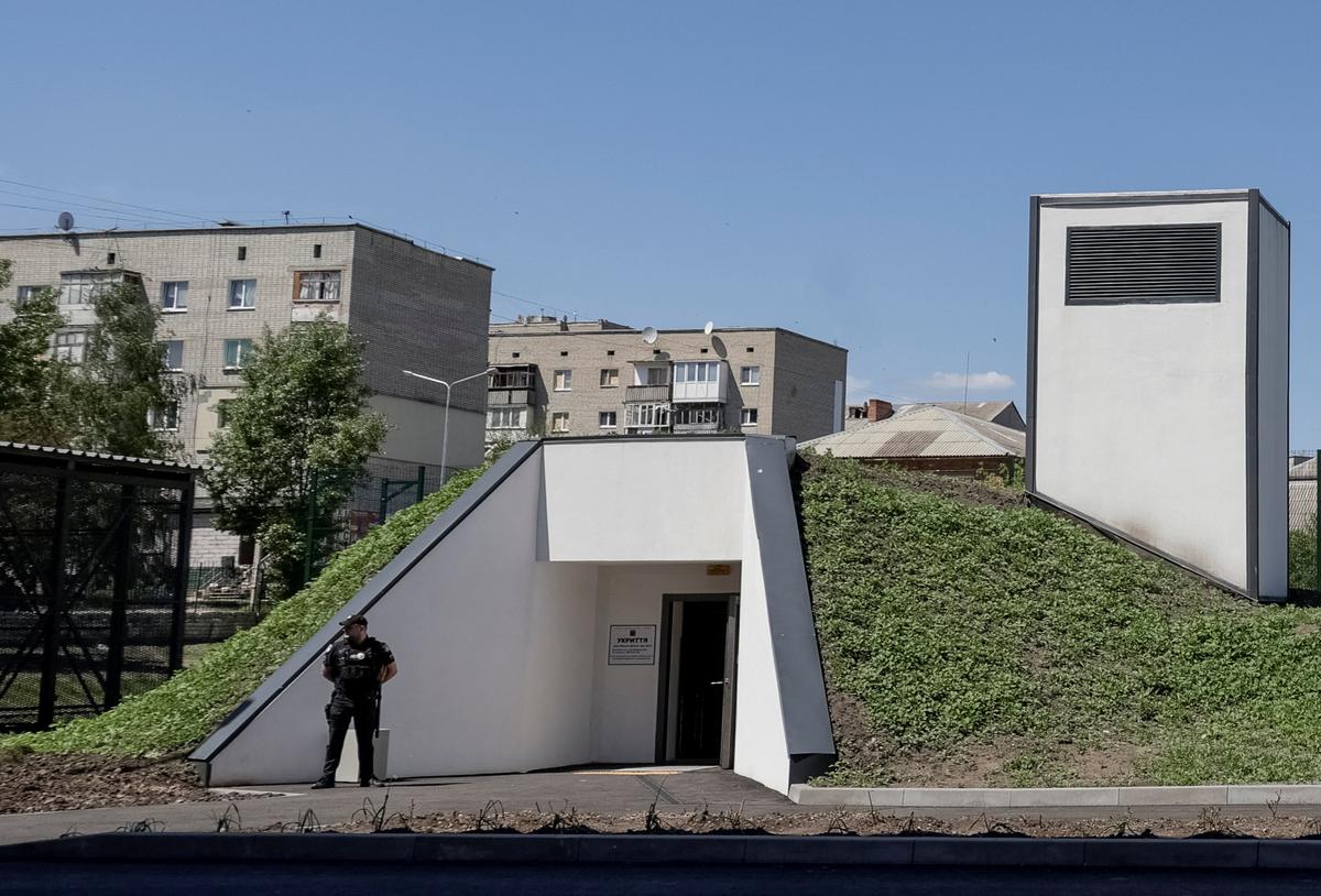 A police officer patrols an area near the underground shelter, amid Russia's attack on Ukraine, in the town of Balakliia, Kharkiv region Ukraine May 13, 2026. REUTERS/Sofiia Gatilova