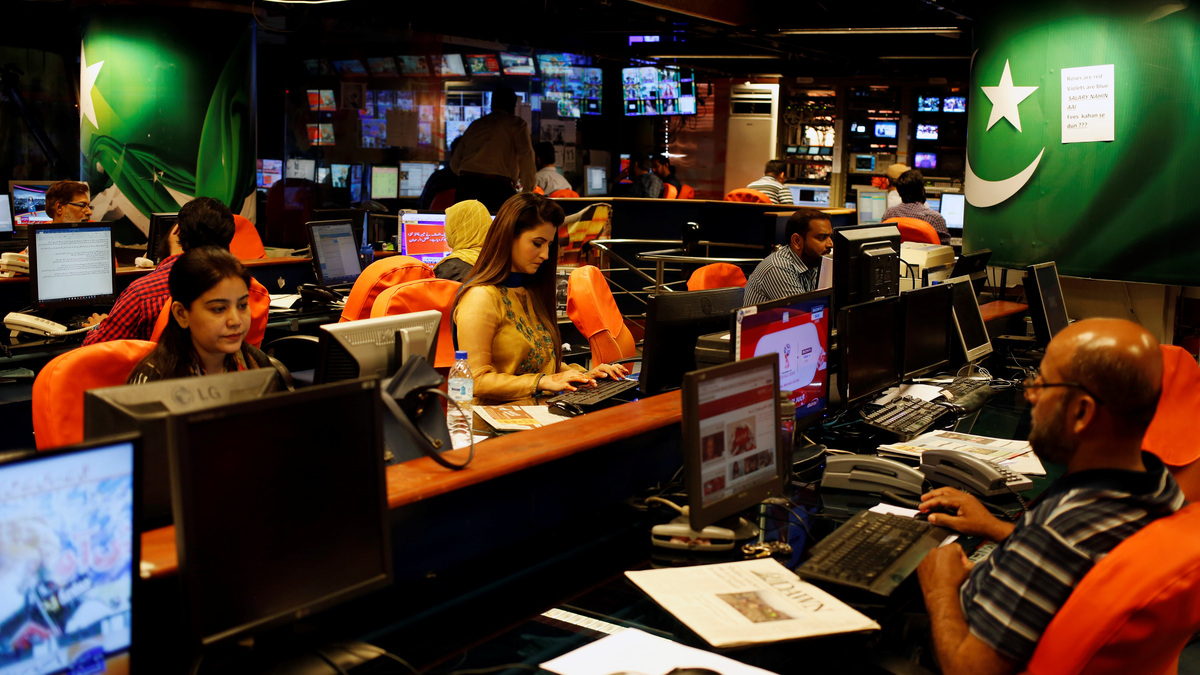 Employees work at the news room of Geo News television channel in Karachi, Pakistan April 11, 2018. Picture taken April 11, 2018. REUTERS/Akhtar Soomro