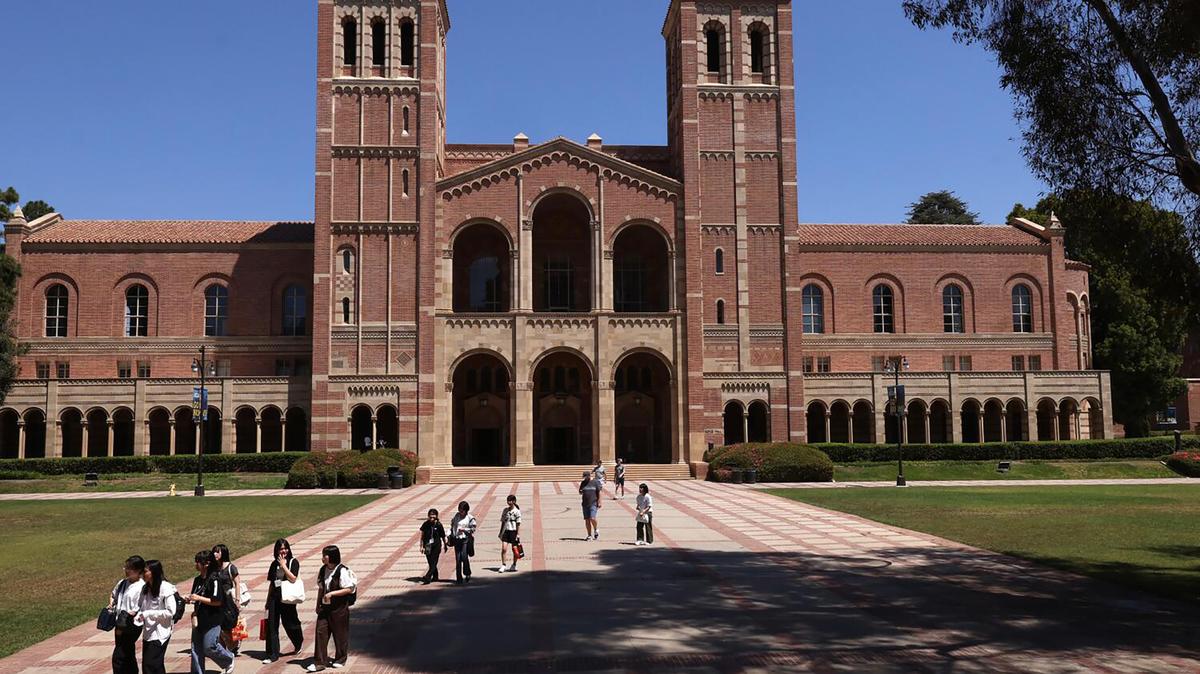 Youth walk through Dickson Plaza against a backdrop of Royce Hall on the UCLA campus in the Westwood neighborhood of Los Angeles on Aug. 7, 2025. (Genaro Molina/Los Angeles Times/TNS)
