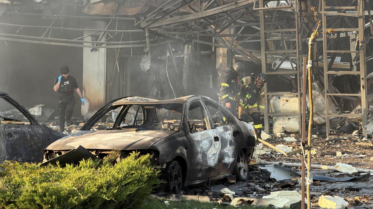 Rescuers work at a site of a Russian air strike, amid Russia's attack on Ukraine, in Zaporizhzhia, Ukraine May 5, 2026. Picture taken with a mobile phone. REUTERS/Serhii Chalyi